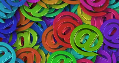 A pile of shiny colourful @ symbols.